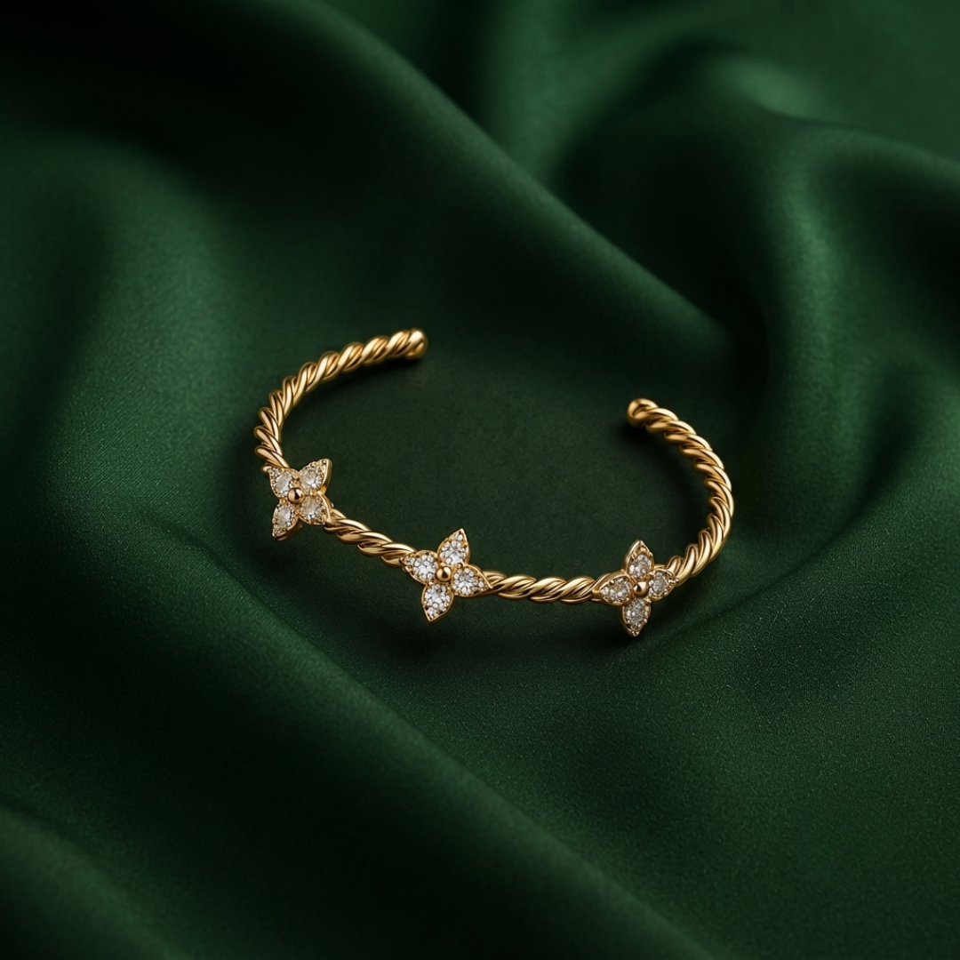 TWISTED CLOVER GOLDEN BANGLE