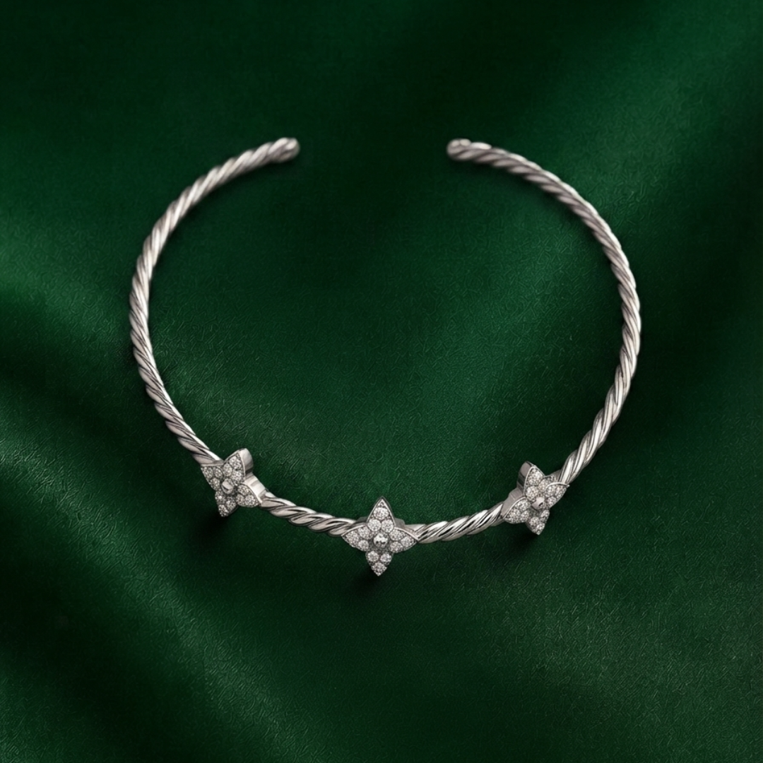 TWISTED CLOVER SILVER BANGLE