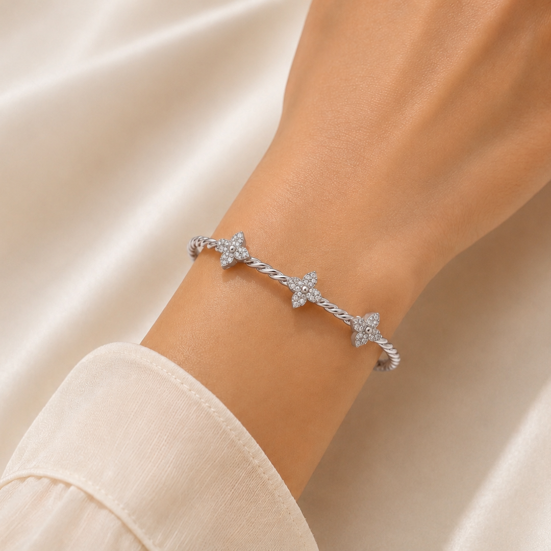 TWISTED CLOVER SILVER BANGLE