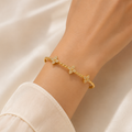 TWISTED CLOVER GOLDEN BANGLE